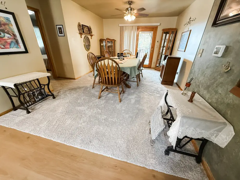 Formal dining room with patterned gray carpet installed by Christian's Carpets